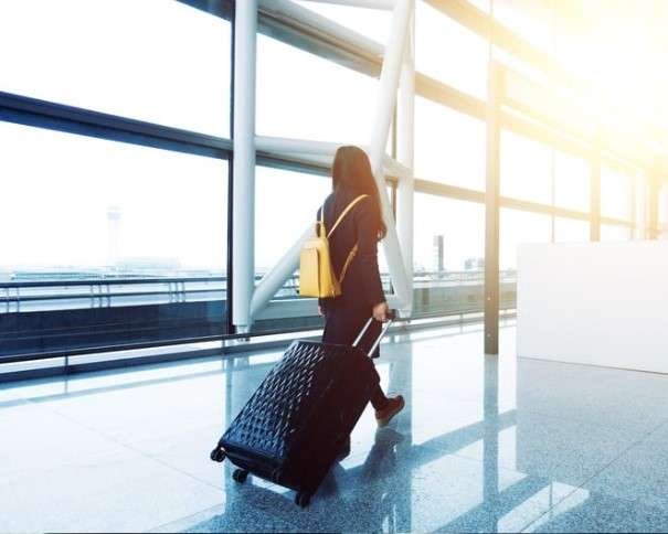 Women with a suitcase at the airport